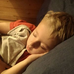 Girl sleeping on bed at home