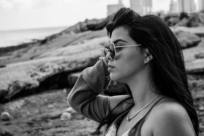 Portrait of young woman looking away