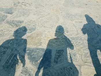 Shadow of people on the beach