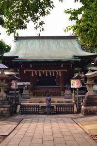 Rear view of woman walking in temple
