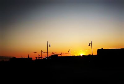 Silhouette landscape against sky during sunset