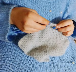 Close-up of woman holding hands