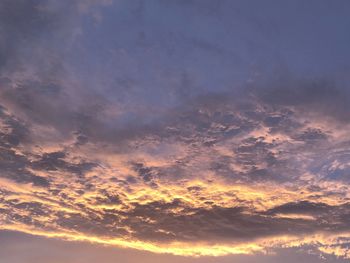 Low angle view of dramatic sky during sunset