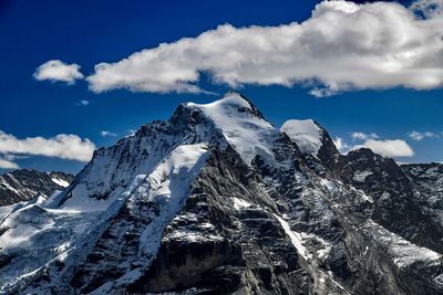 Snow covered mountain against sky