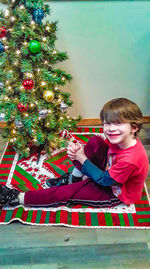 Girl looking at christmas tree