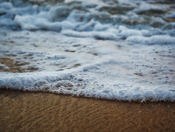 Close-up of waves on beach