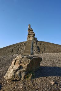 Low angle view of historical building against blue sky