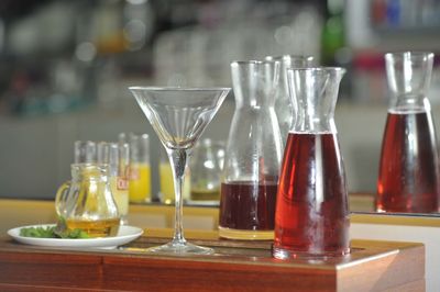 Close-up of wine glasses on table