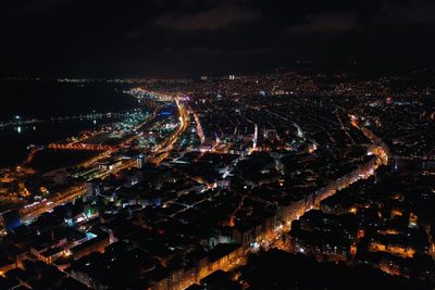 High angle view of illuminated buildings in city at night