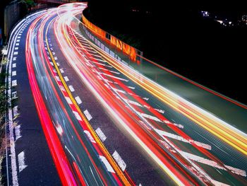 High angle view of light trails on highway at night