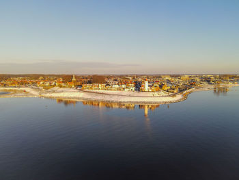 Panoramic view of sea and buildings against clear sky