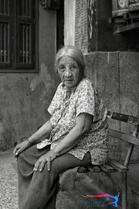 Portrait of woman sitting on chair