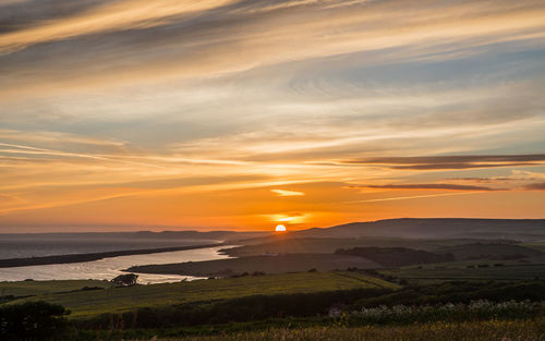 Scenic view of sunset over sea