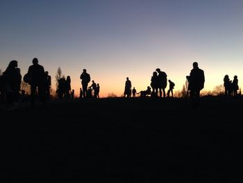 People on landscape at sunset