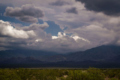 Scenic view of landscape and mountains against sky