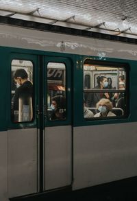 Group of people on train window
