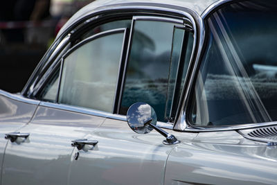 Close-up of vintage car in city