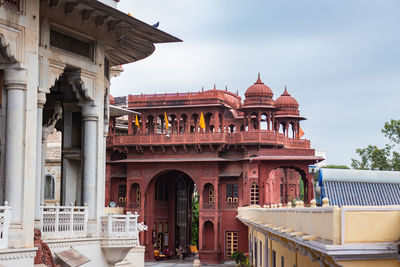 Ancient artistic holy jain trample entrance with cloudy sky at morning 