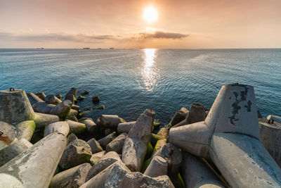 Scenic view of sea against sky during sunset