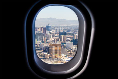 Close-up of airplane wing against sky