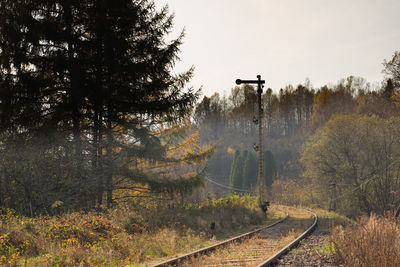 Train on railroad track against sky