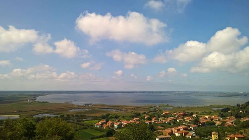 High angle view of houses and sea against sky