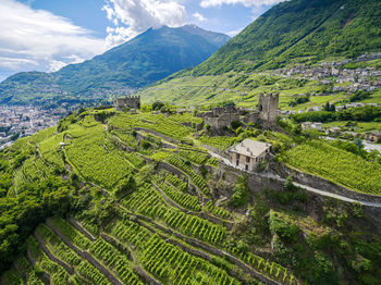 Scenic view of green mountains against sky