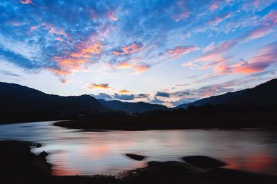 Scenic view of lake against sky during sunset