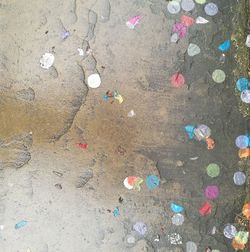 High angle view of garbage on sand