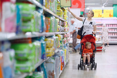 Mother and son at supermarket