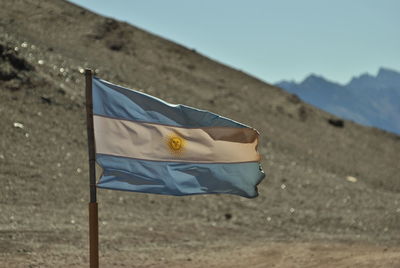 Close-up of flag against the sky