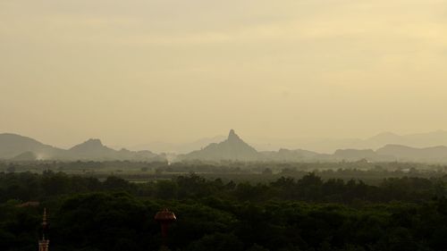 Scenic view of mountains against sky during sunset