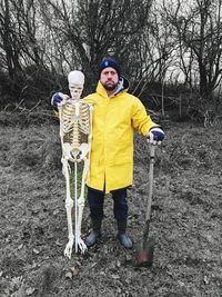 Portrait of man standing in field