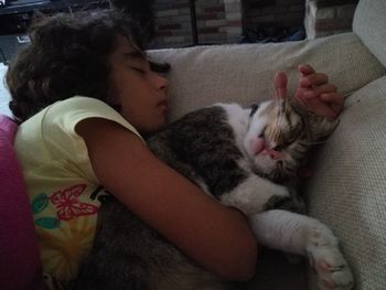 Cute baby girl with cat