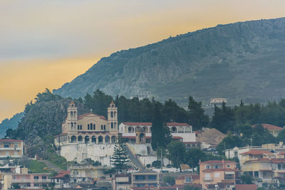 Buildings in town against sky