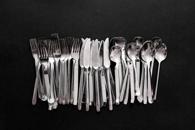 Directly above shot of cutlery black background