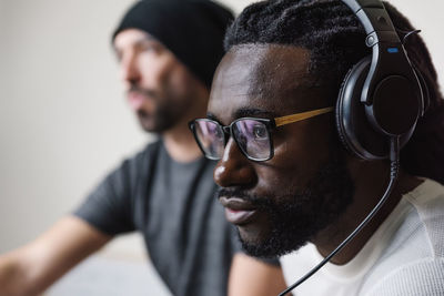 Man listening music while sitting in studio