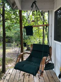 Empty chairs and tables in forest