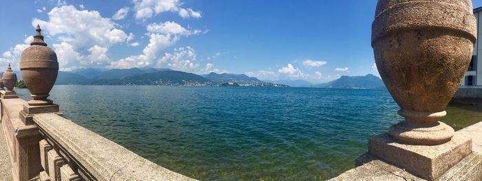 Panoramic view of sea against blue sky