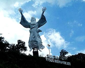 Low angle view of statue against sky