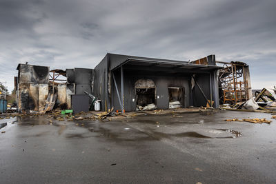 Outside the store, which was bombed, was looted soldiers, occupiers. the looters destroyed the shop.