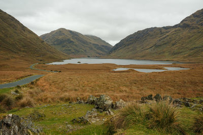 Scenic view of landscape and mountains against sky