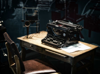 Close-up of old camera on table