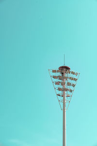 Low angle view of street light against blue sky