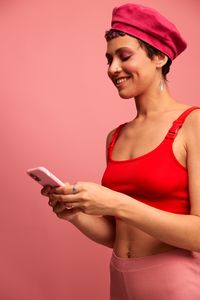 Side view of young woman suffering from mobile phone