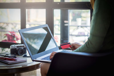 Woman using laptop on table