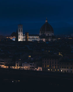 Illuminated buildings in city at night