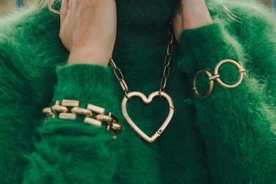 Close-up of woman hand holding heart shape