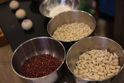 High angle view of various beans in bowl on table