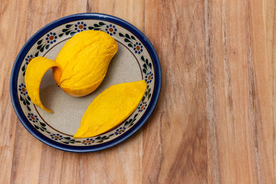 High angle view of yellow eggs in plate